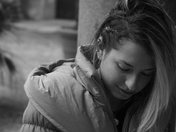 Portrait of a beautiful young woman with eyes closed