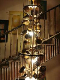 Low angle view of illuminated lamp hanging in row