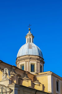 Low angle view of building against clear blue sky