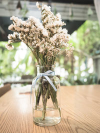 Close-up of flower vase on table