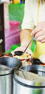 Midsection of woman preparing food