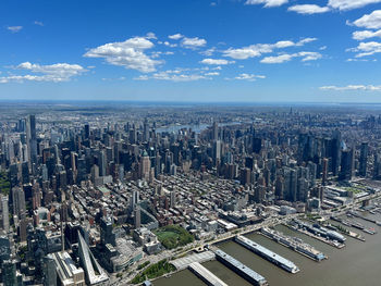 Aerial view of cityscape against sky