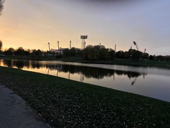 Scenic view of lake against sky during sunset