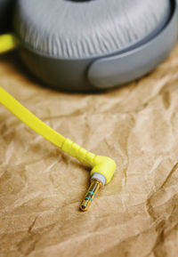 Close-up of headphones on brown paper