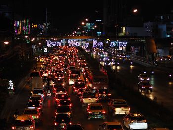 High angle view of illuminated city street at night