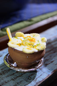 Banana mango lassi in clay pot in varanasi india