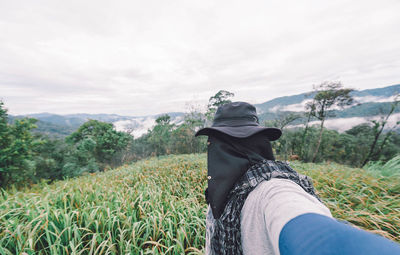 Man standing on countryside landscape