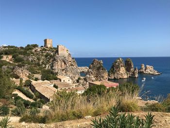 Scenic view of sea against clear blue sky