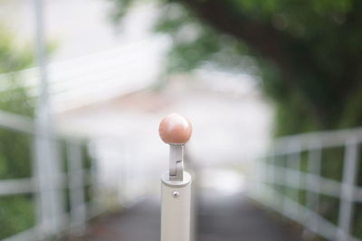 Close-up of metallic railing against blurred background