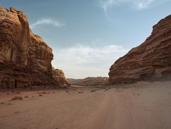 Rock formations in desert against sky