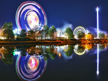 Reflection of illuminated lights on water at night