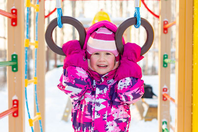 Half-length portrait of a little girl in winter in kindergarten. outdoor games, healthy lifestyle.