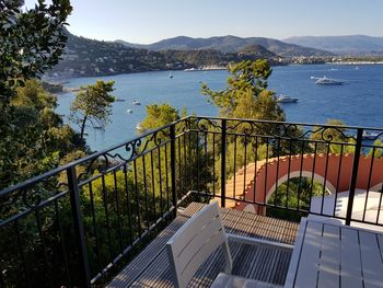 High angle view of stairs by lake against sky