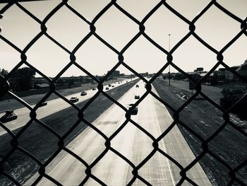 Full frame shot of chainlink fence against sky