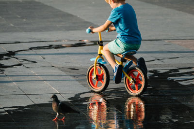 Side view of man riding bicycle