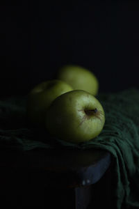 Close-up of apples against black background