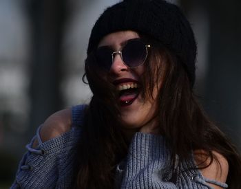 Portrait of young woman wearing sunglasses