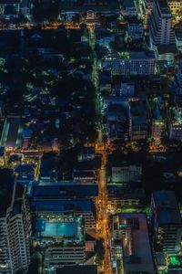 High angle view of city lit up at night