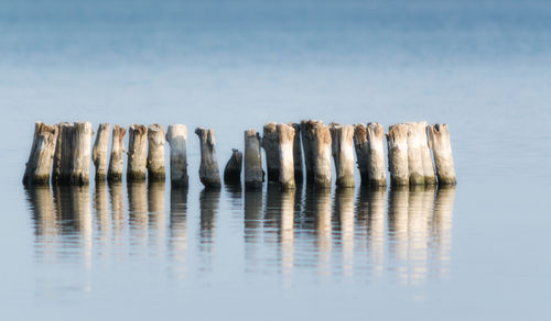 Panoramic view of rocks in sea against sky