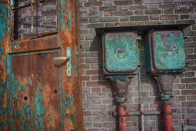 Close-up of pipe on brick wall