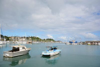 Boats in sea against sky