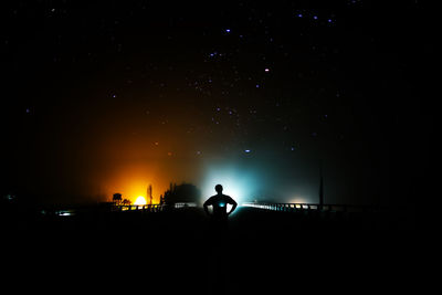 Silhouette people at night