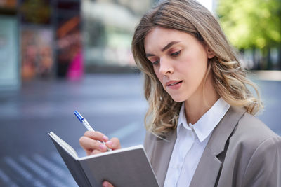 Businesswoman using mobile phone