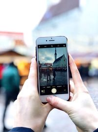 Close-up of hand using mobile phone