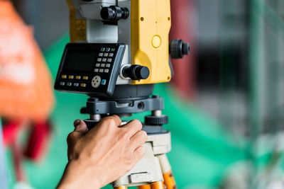 Close-up of hand with machinery