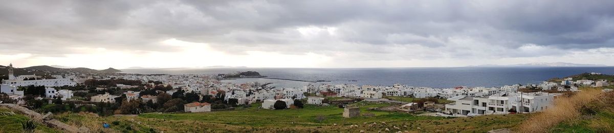 Panoramic view of townscape by sea against sky