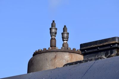 Low angle view of historic building against clear blue sky