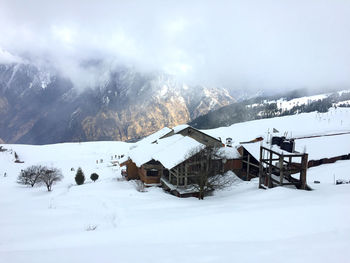 Scenic view of snow covered mountain against sky