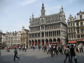 Group of people in front of buildings in city