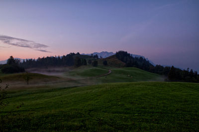 Scenic view of landscape against sky during sunset