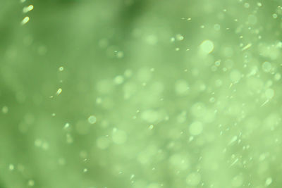 Full frame shot of raindrops on water drops