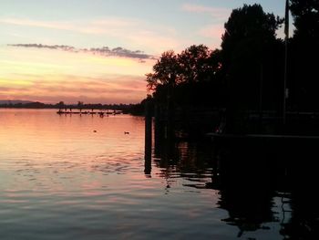 Scenic view of lake at sunset