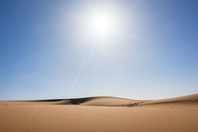 Scenic view of desert against clear sky