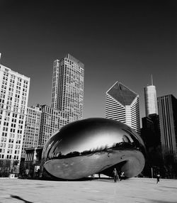 Modern buildings in city against clear sky