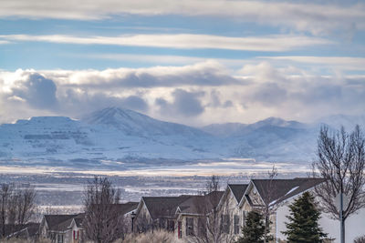 Scenic view of snowcapped mountains against sky