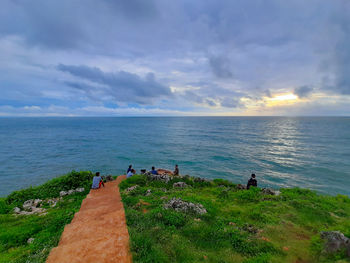 Young adult local tourist enjoying their trip to a rocky beach in gunung kidul on java, indonesia.