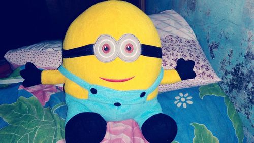 Close-up of toys on bed