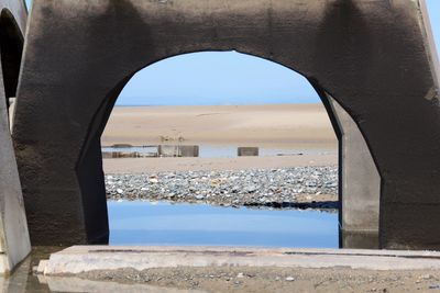 Sea seen through arch window