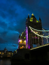 Low angle view of illuminated building at night