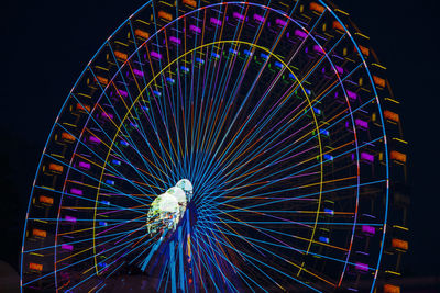 Germany, bavaria, wurzburg, multiple exposure of spinning ferris wheel at night