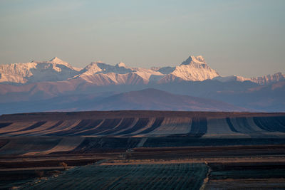 Scenic view of mountains against sky during sunset