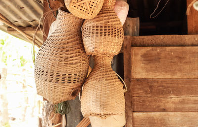 Close-up of wicker basket hanging on table