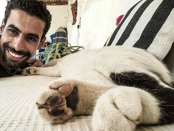 Portrait of smiling young man lying down