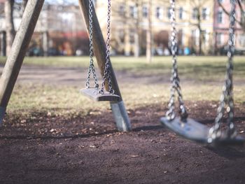 Close-up of swing in playground