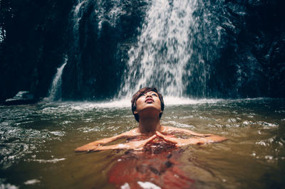 Full length of woman swimming in water