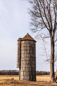 Abandoned silo with beautiful tree